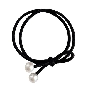 Élastique à cheveux noir à double boucle avec élégants accents de perles blanches