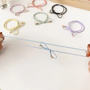 Colorful bow elastic hair ties showing high stretchability and diverse pastel colors