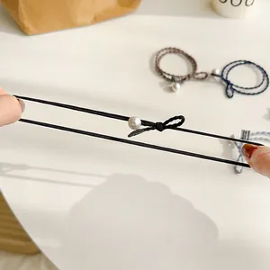 Elastische haarelastiekjes met strikken en parels tonen hoge rekbaarheid en duurzaamheid