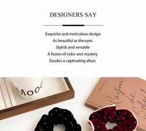 Detail of French retro velvet scrunchies with polka dots in black and burgundy red