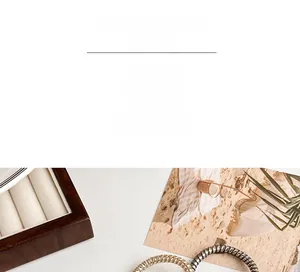 Detailed view of spiral metallic hair ties in gold and silver on a wooden display box