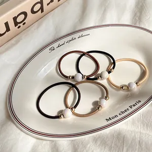 Five-pack of high-elasticity neutral tone hair ties with elegant pearl beads