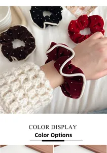 Detail of velvet scrunchies with white woven edges and sparkling rhinestone accents