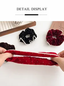 Close-up of velvet scrunchies showing high elasticity and soft dot texture fabric