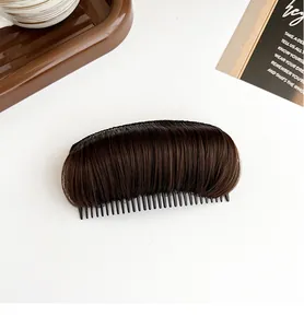 Macro shot of dark brown wig hair pad with invisible comb for hair root volume boosting