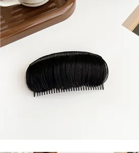 Detailed view of invisible black hair volume clip with natural synthetic hair and comb