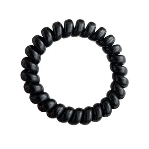 Glossy black spiral hair tie with high-elasticity phone cord design on white background