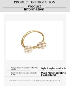 Detail view of khaki plaid bow hair tie with dimensions and product specifications