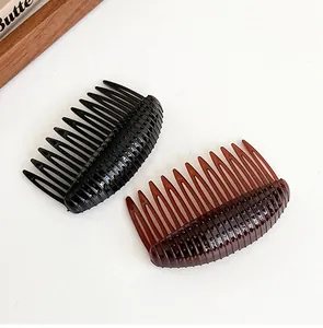 Close-up of crescent hair combs in black and amber colors with non-slip texture