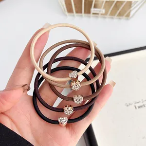 Set di cinque elastici per capelli con cuori di strass nei toni del caffè
