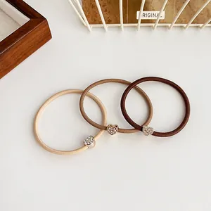 Set di tre elastici per capelli con cuore di strass in tonalità neutre caffè e beige
