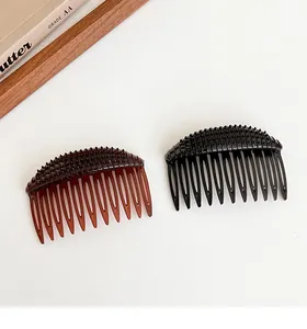Close-up of black and coffee hair combs for volumizing and fixing hairstyles