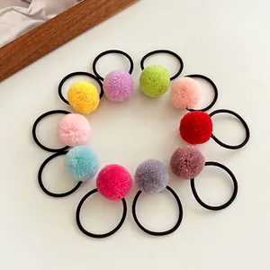 Set of 10 colorful pom-pom hair ties for girls made of soft plush and high elastic rubber