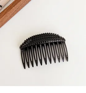 Close-up of a 12-tooth black non-slip hair comb tool for invisible volume boosting