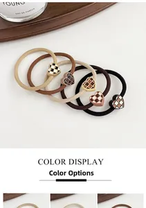 Detail of high-elasticity hair ties with checkered heart accents in earth tones