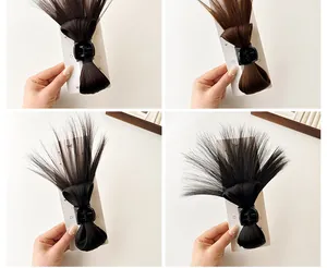 Detailed view of messy bun hair claw clip in natural black and dark brown synthetic hair