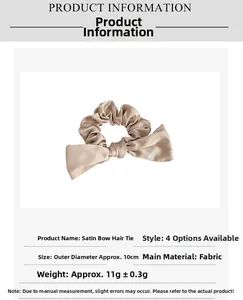 Détail d'un chouchou en satin avec nœud montrant la texture fine et l'éclat champagne