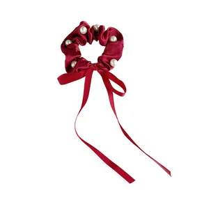 Elegant wine red satin scrunchie with long bow ribbon and decorative white pearls