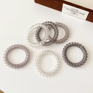 Set of 6 gradient spiral hair ties in transparent gray and pink for ponytail styling