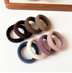 Detail of multi-color thick ribbed hair ties showing elastic fabric texture and durability