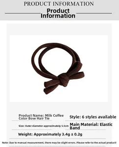 Detail view of coffee bow hair tie showing 5.5cm diameter size and elastic material
