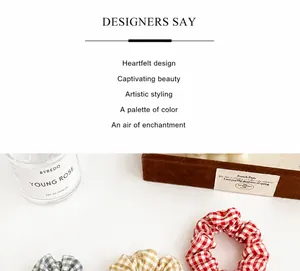 Detail of red and blue plaid scrunchie set with pleated fabric texture in lifestyle setting