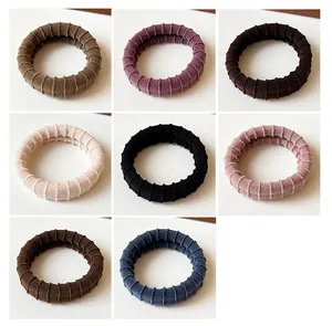 Texture detail of durable ribbed elastic hair ties in eight Morandi color options