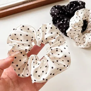 French style polka dot satin scrunchies in black and beige with a glossy finish