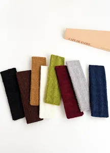 Différentes couleurs de bandeaux en tissu éponge pour le sport et les soins du visage