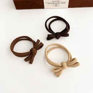 Three-piece set of cream brown bow hair ties with elastic seamless ribbed fabric