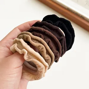 Five-piece ruffle hair scrunchie set in assorted neutral colors including beige and coffee