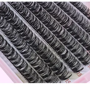 Macro shot of 15mm synthetic cluster eyelashes showing volume and natural curl finish