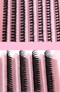 Macro detail of natural dense cluster eyelashes with curl and texture on pink tray