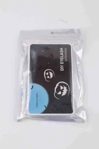 DIY eyelash extension kit with Halloween theme packaging including pumpkin and bat motifs