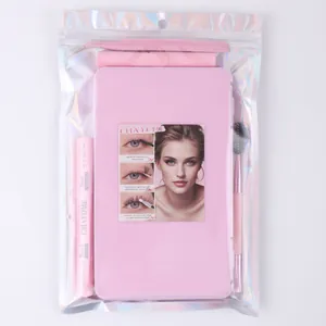 Pink lash extension kit with bond, seal, tweezers and brush in holographic bag