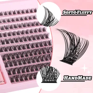 Macro view of handmade soft and fluffy individual lash clusters in a pink storage tray