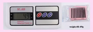 Detailed lash kit view including multi-length false eyelashes, bond and seal glue, and tweezers