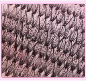 Macro di ciglia finte a ciuffetti che mostra fibre sintetiche nere e dettaglio della radice