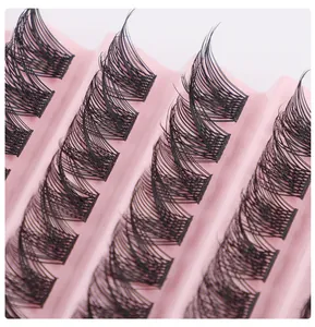 Macro shot of 120 clusters black individual DIY lashes on a pink wavy display tray