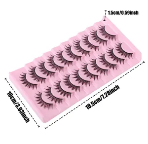 Dettaglio di 10 paia di ciglia finte nere lunghe 1,5 cm su un vassoio rosa
