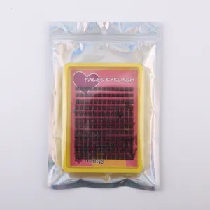 Detailed macro view of DIY false eyelash clusters in laser packaging and yellow plastic tray