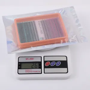 Σετ βλεφαρίδων DIY 280 τεμαχίων σε πορτοκαλί δίσκο, τοποθετημένο σε ψηφιακή ζυγαριά