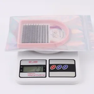 Digital scale showing the total weight of 23g for the individual lash cluster kit