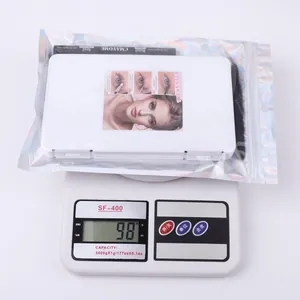 DIY eyelash extension kit in holographic bag including bond, seal, and tweezers