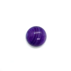 Detailed view of a round purple striped agate cabochon with a polished gemstone surface