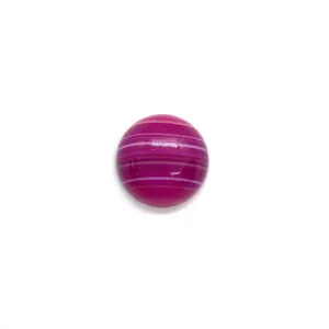Close-up of a polished round purple striped agate cabochon stone for DIY jewelry making