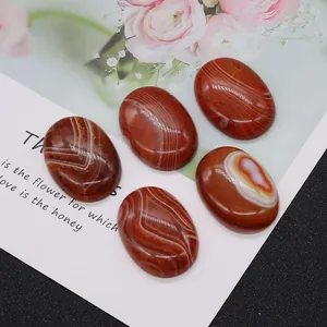 Five oval red onyx stones with natural white striped patterns for jewelry making