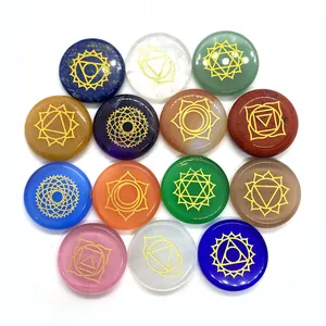 Set of 14 natural chakra energy stones with gold engraved symbols and polished finish