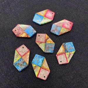 Close-up of hexagonal multi-colored natural stone pendants with textured surface for DIY