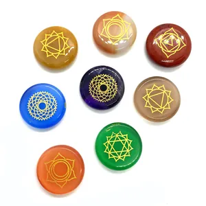 8-piece set of polished chakra crystals with engraved golden spiritual symbols